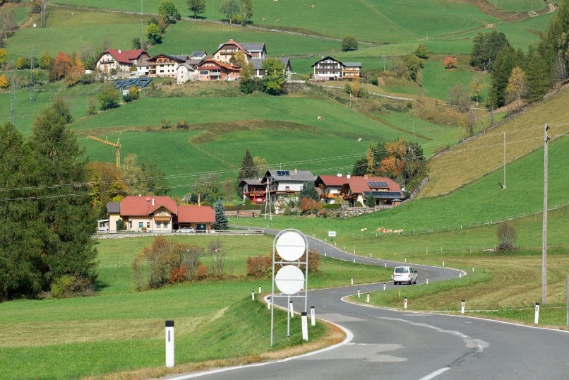 Winding road through the village of Rennweg am Katschberg, located in the Katsch Valley (Katschtal) in the Alps mountains. Carinthia, Austria.